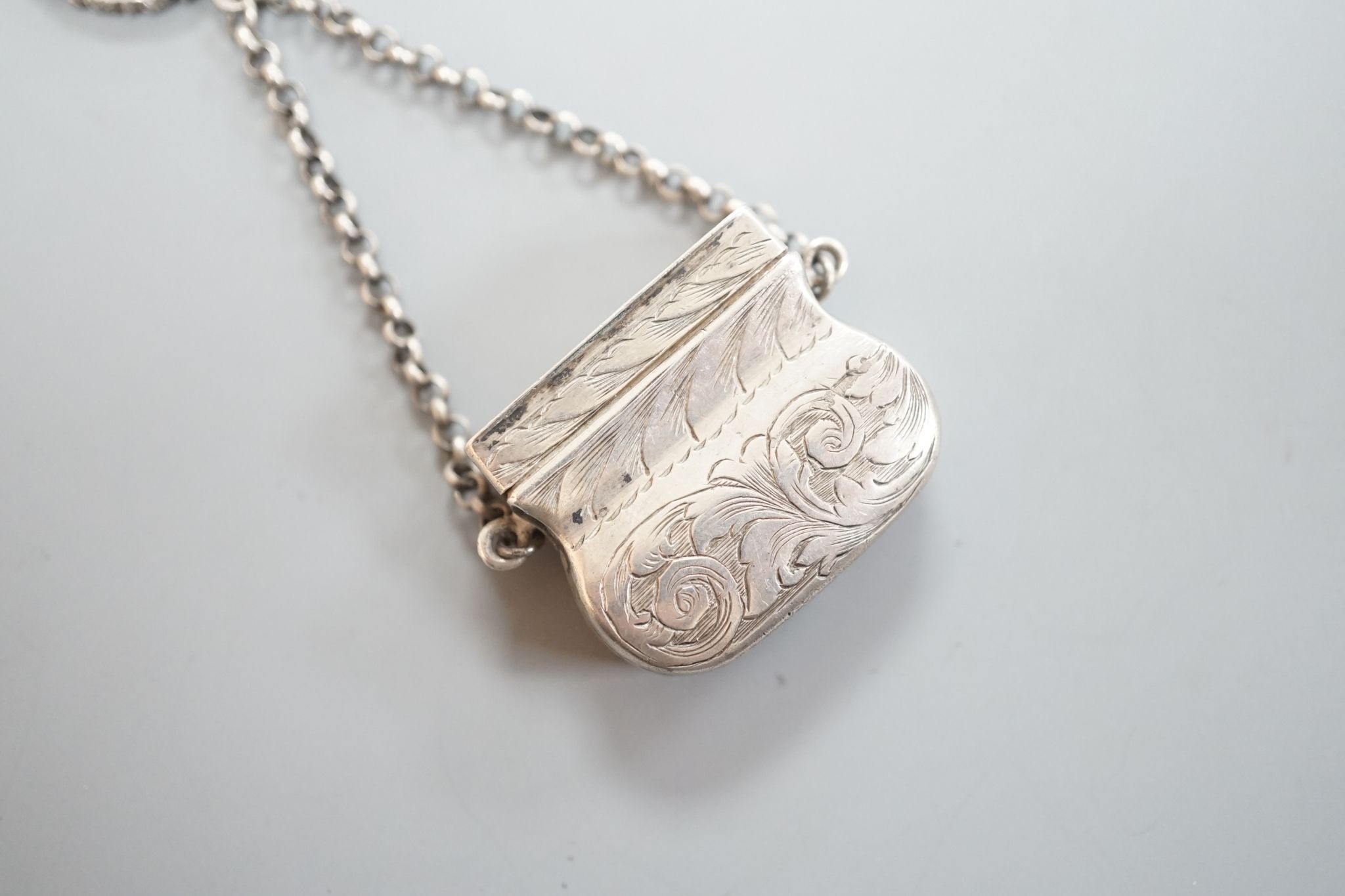 A Victorian novelty silver vinaigrette, modelled as a handbag, John Tongue, Birmingham, circa, 1840 (date letter rubbed), width 27mm.